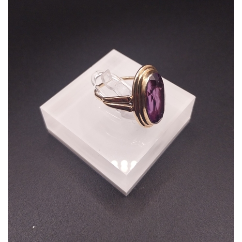 54 - Gold amethyst ring stamp rubbed. Wt: 3.5 grms. Size M.