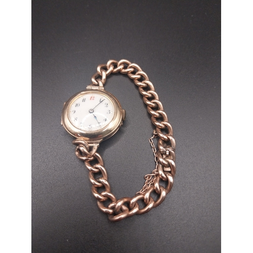 61 - 9 ct ladies gold watch with chain clasp. Wt: 21.8 grms.