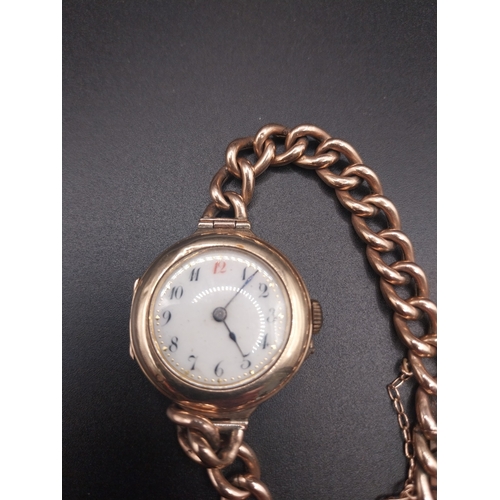 61 - 9 ct ladies gold watch with chain clasp. Wt: 21.8 grms.