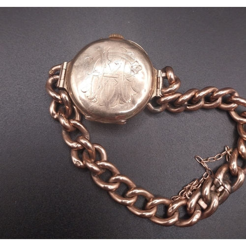 61 - 9 ct ladies gold watch with chain clasp. Wt: 21.8 grms.