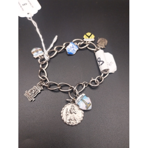 8 - Silver charm bracelet. Some charms marked 835. Wt: 16 grms.