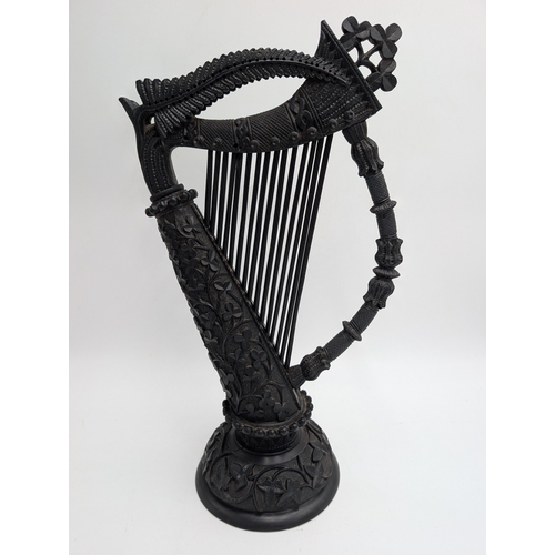 19th C. Irish bog oak Harp decorated with Shamrocks, oak leaves and ferns. {44 cm H x 22 cm Dia.}.