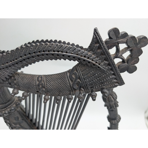 114 - 19th C. Irish bog oak Harp decorated with Shamrocks, oak leaves and ferns. {44 cm H x 22 cm Dia.}.