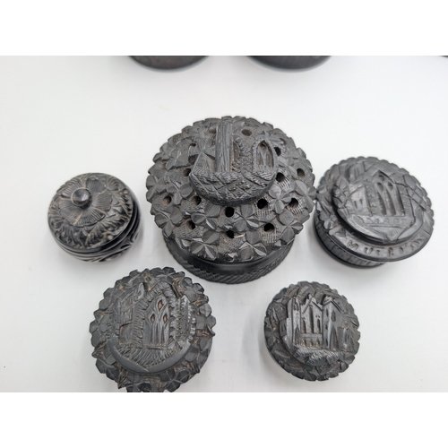 13 - Collection of nine 19th C. Irish bog oak boxes with various carvings of Wolfhound, Muckross Abbey et... 