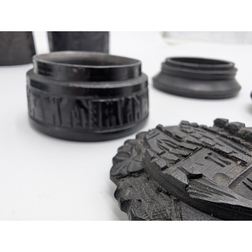 13 - Collection of nine 19th C. Irish bog oak boxes with various carvings of Wolfhound, Muckross Abbey et... 