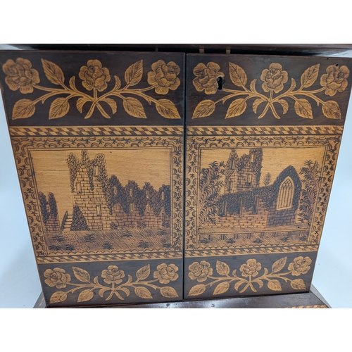 143 - 19th C. Irish Killarney wood arbutus and marquetry Cigar cabinet, the lid inlaid with vignette of Gl... 