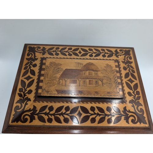 143 - 19th C. Irish Killarney wood arbutus and marquetry Cigar cabinet, the lid inlaid with vignette of Gl... 