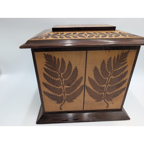 143 - 19th C. Irish Killarney wood arbutus and marquetry Cigar cabinet, the lid inlaid with vignette of Gl... 
