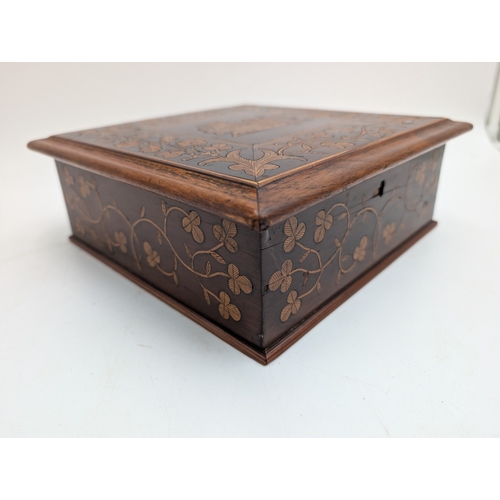 147 - 19th C. Irish Killarney wood arbutus and marquetry box, the lid inlaid with vignette of Muckross Abb... 