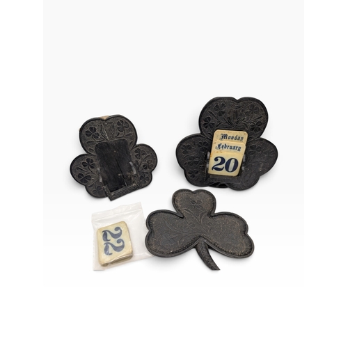 15 - Collection of nine pieces of 19th C. Irish bog oak including calendars, pin tray and Bridge counter.... 