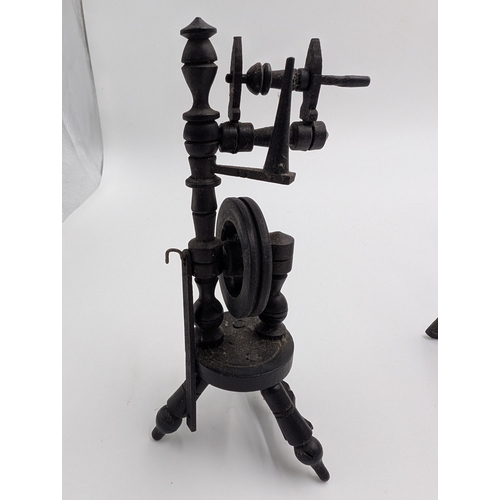 19 - Seven 19th C. Irish bog oak pot stands and spinning wheel. {12 cm H x 4 cm W x 4 cm D} approx.