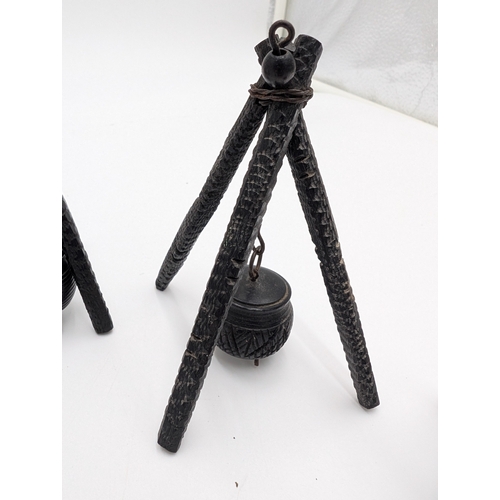 19 - Seven 19th C. Irish bog oak pot stands and spinning wheel. {12 cm H x 4 cm W x 4 cm D} approx.