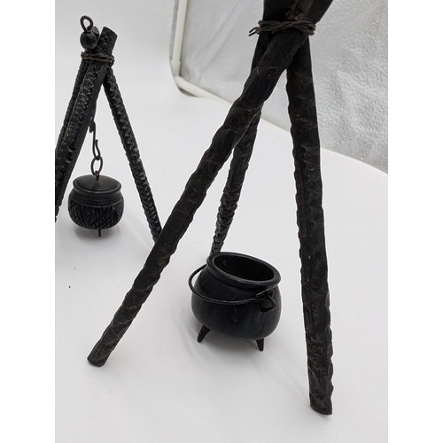 19 - Seven 19th C. Irish bog oak pot stands and spinning wheel. {12 cm H x 4 cm W x 4 cm D} approx.