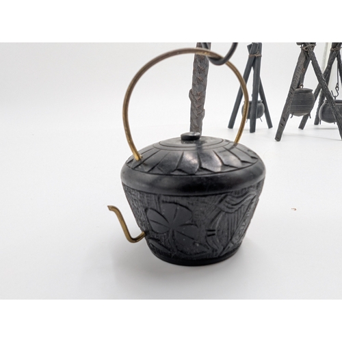 19 - Seven 19th C. Irish bog oak pot stands and spinning wheel. {12 cm H x 4 cm W x 4 cm D} approx.