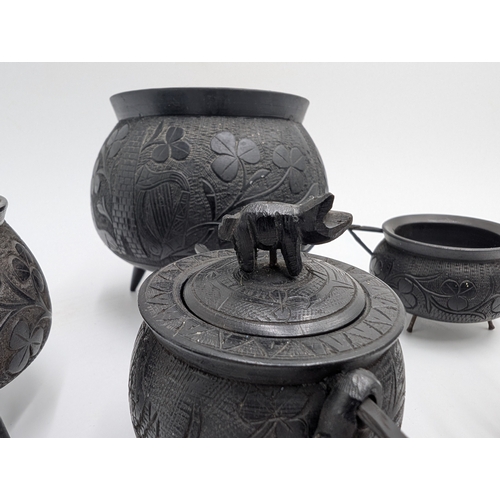 20 - Six items of 19th C. Irish bog oak including three legged pot inkwell and other pots. {10 cm H x 11 ... 