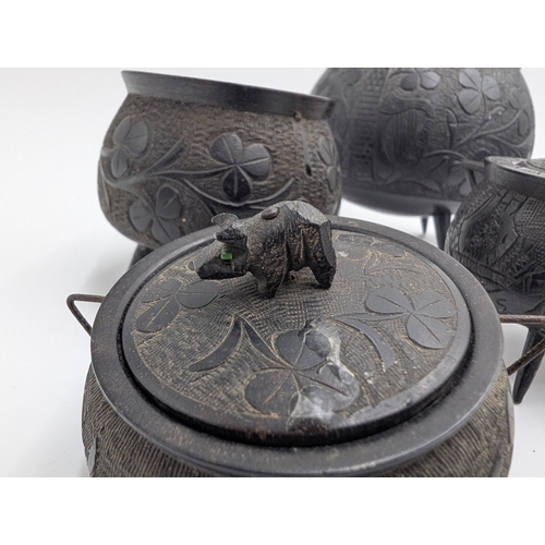 20 - Six items of 19th C. Irish bog oak including three legged pot inkwell and other pots. {10 cm H x 11 ... 