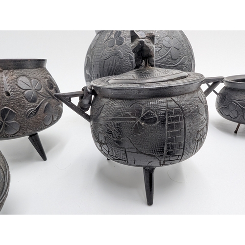 20 - Six items of 19th C. Irish bog oak including three legged pot inkwell and other pots. {10 cm H x 11 ... 