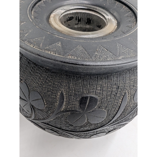 20 - Six items of 19th C. Irish bog oak including three legged pot inkwell and other pots. {10 cm H x 11 ... 