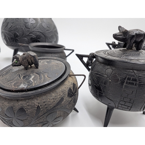 20 - Six items of 19th C. Irish bog oak including three legged pot inkwell and other pots. {10 cm H x 11 ... 