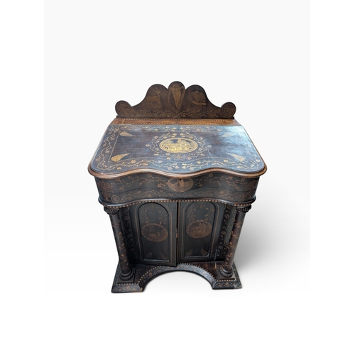 19th. C. Irish Killarney wood arbutus and marquetry davenport the raised panel back inlaid with a central crowned Harp flanked by Eagle and Deer above a writing slope inlaid with vignettes of the Swiss Cottage the centre decorated with Shamrocks, Thistles and Roses with fitted interior above the two door cupboard base with column supports, decorated with vignettes of Muckross House and other historical buildings . {119 cm H x 86 cm W x 68 cm D}.