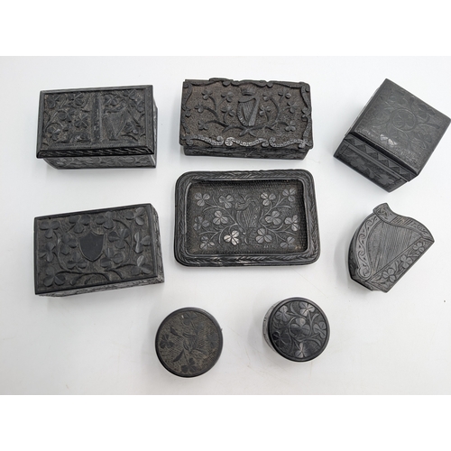 21 - Collection of seven 19th C. Irish bog oak lidded boxes and a tray decorated with Shamrocks. {2 cm H ... 
