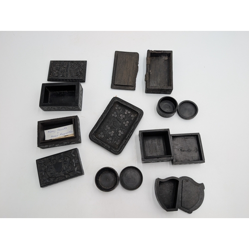 21 - Collection of seven 19th C. Irish bog oak lidded boxes and a tray decorated with Shamrocks. {2 cm H ... 