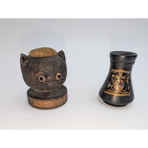 22 - Lot of 19th C. Irish bog oak sewing related items including pin cushions, pin holders etc.