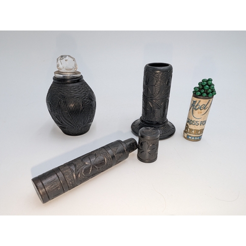 22 - Lot of 19th C. Irish bog oak sewing related items including pin cushions, pin holders etc.