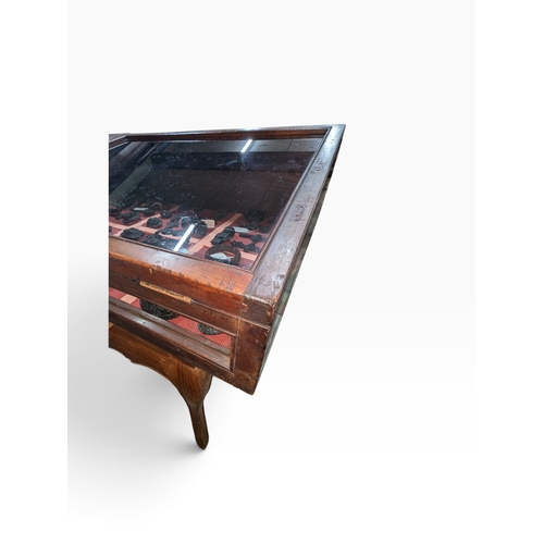 28 - Early 20th C. mahogany glazed counter display cabinet with key. {25 cm H x 145 cm W x 67 cm D}.