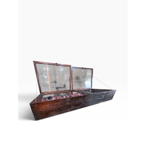 28 - Early 20th C. mahogany glazed counter display cabinet with key. {25 cm H x 145 cm W x 67 cm D}.