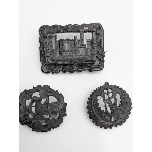 29 - Nine pieces of 19th C. Irish bog oak jewellery including three brooches, three bracelets and three c... 
