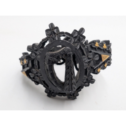 29 - Nine pieces of 19th C. Irish bog oak jewellery including three brooches, three bracelets and three c... 