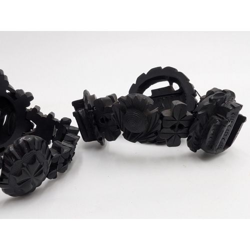 29 - Nine pieces of 19th C. Irish bog oak jewellery including three brooches, three bracelets and three c... 