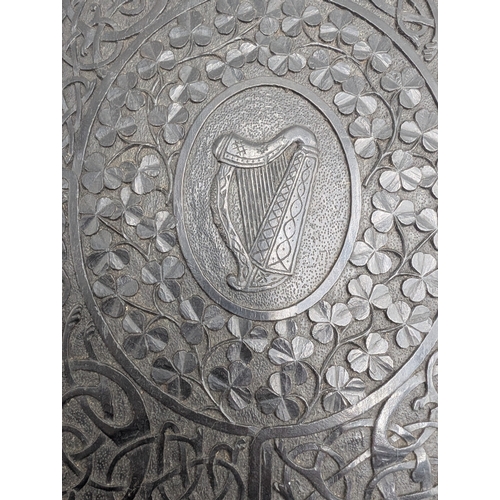 296 - 19th C. Irish carved bog oak Ledger decorated with Shamrocks and central Harp design. {31 cm H x 23 ... 