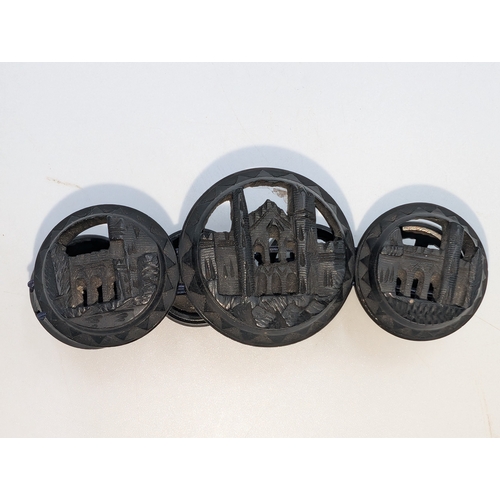 30 - Nine pieces of 19th C. Irish bog oak jewellery including three brooches, three bracelets and three c... 