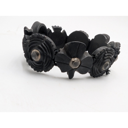 32 - Nine pieces of 19th C. Irish bog oak jewellery including three brooches, three bracelets and three c... 