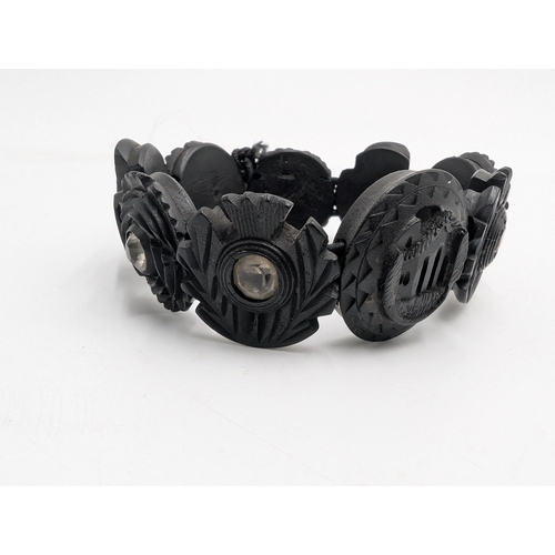 32 - Nine pieces of 19th C. Irish bog oak jewellery including three brooches, three bracelets and three c... 