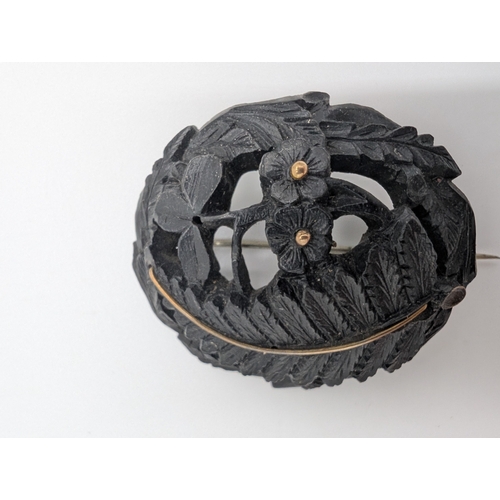 33 - Nine pieces of 19th C. Irish bog oak jewellery including three brooches, three bracelets and three c... 
