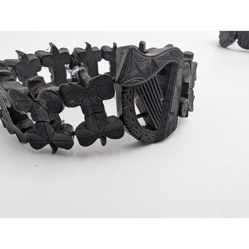 33 - Nine pieces of 19th C. Irish bog oak jewellery including three brooches, three bracelets and three c... 