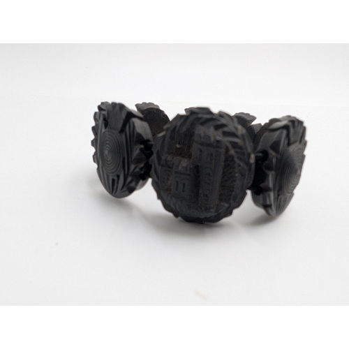 33 - Nine pieces of 19th C. Irish bog oak jewellery including three brooches, three bracelets and three c... 