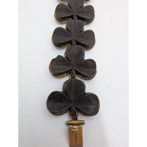 34 - 19th C. Irish bog oak necklace, Shamrock bracelet and brooch.