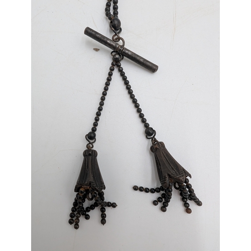 35 - Two 19th C. Irish bog oak necklaces and pair of earrings.