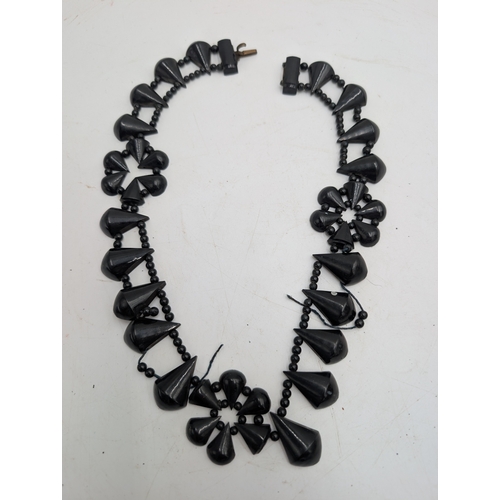 36 - Miscellaneous lot of 19th C. Irish bog oak jewellery including cross pendant, necklaces and other in... 