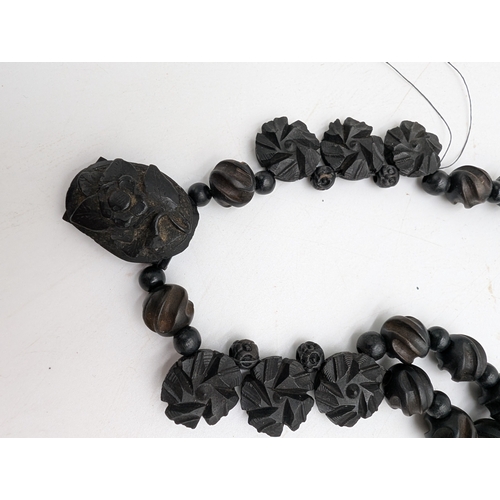 36 - Miscellaneous lot of 19th C. Irish bog oak jewellery including cross pendant, necklaces and other in... 