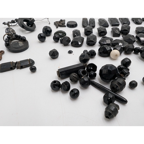 36 - Miscellaneous lot of 19th C. Irish bog oak jewellery including cross pendant, necklaces and other in... 