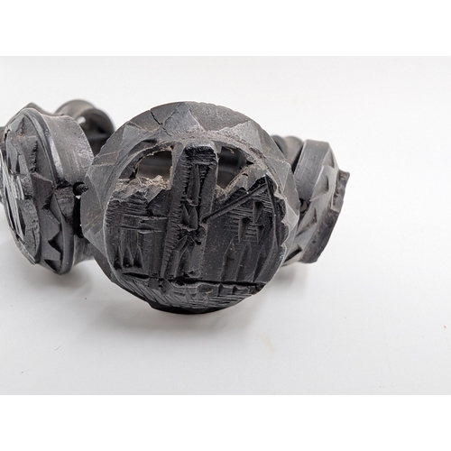 37 - Five 19th C. Irish bog oak brooches, two bracelets and two cross pendants.