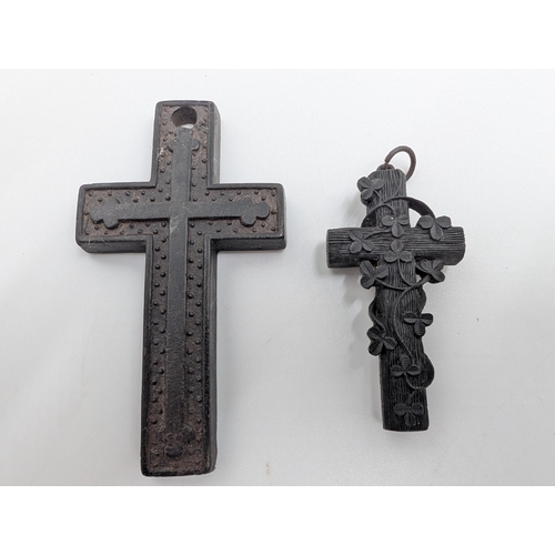 37 - Five 19th C. Irish bog oak brooches, two bracelets and two cross pendants.