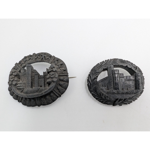 37 - Five 19th C. Irish bog oak brooches, two bracelets and two cross pendants.