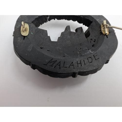 37 - Five 19th C. Irish bog oak brooches, two bracelets and two cross pendants.