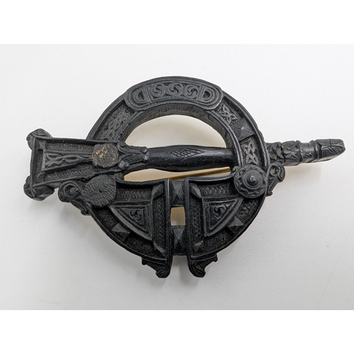 37 - Five 19th C. Irish bog oak brooches, two bracelets and two cross pendants.